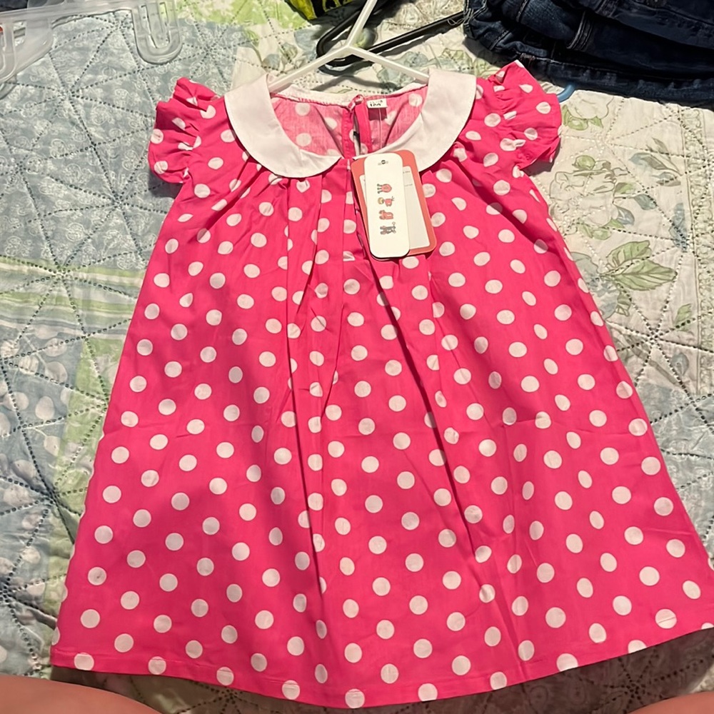Pink and white polkadot dress with ruffle sleeve